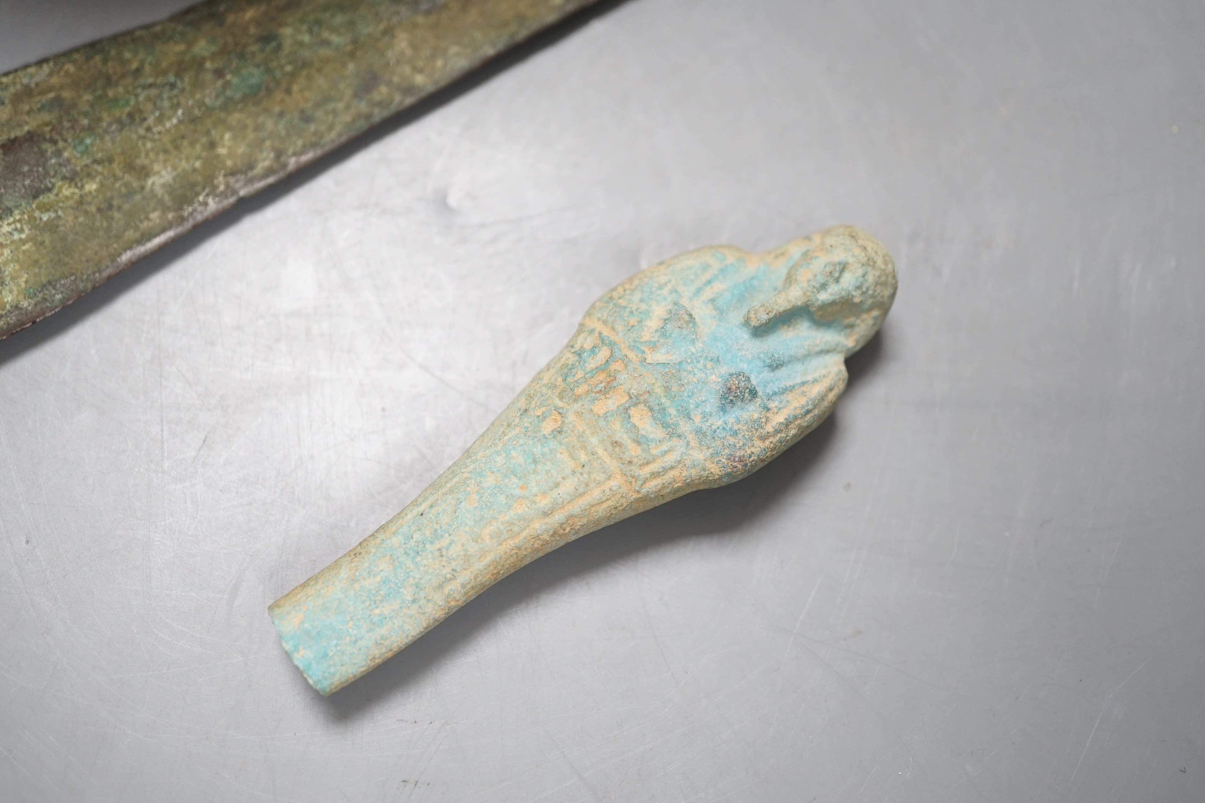 Antiquities to include a Luristan bronze spear head, an Egyptian ushabti (af) and an alabaster jar, spear head 30.5cm long